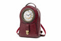 Red backpack with clock face design on a white background